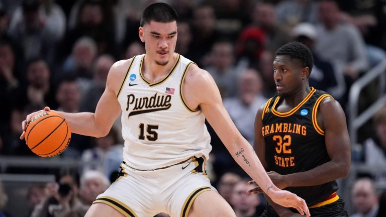 Purdue center Zach Edey (15) drives around Grambling State forward Malik Lamin (32) in the first half of a first-round college basketball game in the NCAA Tournament, Friday, March 22, 2024, in Indianapolis. (AP Photo/Michael Conroy)