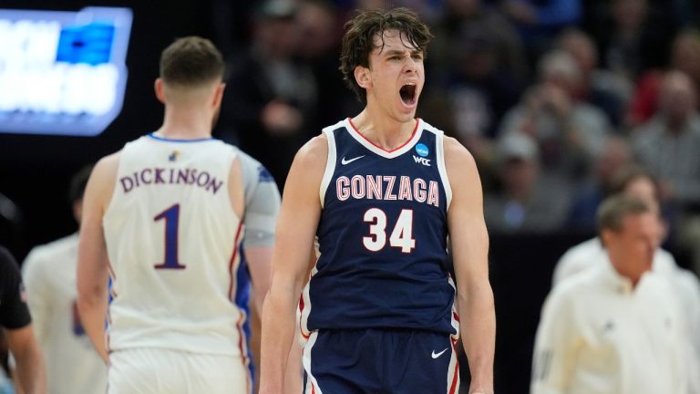 Gonzaga forward Braden Huff reacts after dunking against Kansas during the first half of a second-round college basketball game in the NCAA Tournament in Salt Lake City, Saturday, March 23, 2024. (Rick Bowmer/AP Photo)