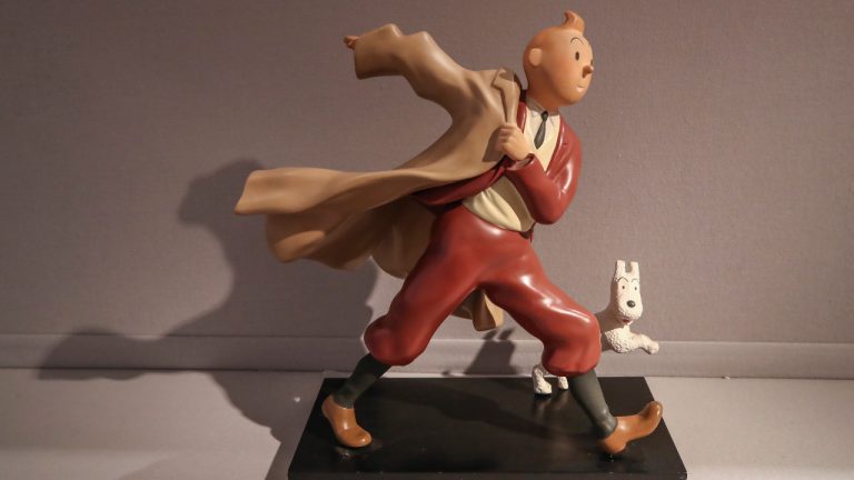 A 1988 polychrome resin sculpture of the comic character Tintin and his dog snowy from the 1941 "The Crab with the Golden Claws" album drawn by Belgian creator Herge is displayed at the Artcurial auction house in Paris, on Jan. 13, 2021. (Michel Euler/AP)