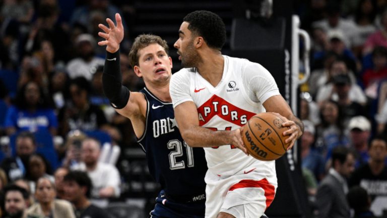 Toronto Raptors centre Jontay Porter, right, is defended by Orlando Magic centre Moritz Wagner (21) during the first half of an NBA basketball game, Sunday, March 17, 2024, in Orlando, Fla. (Phelan M. Ebenhack/AP)