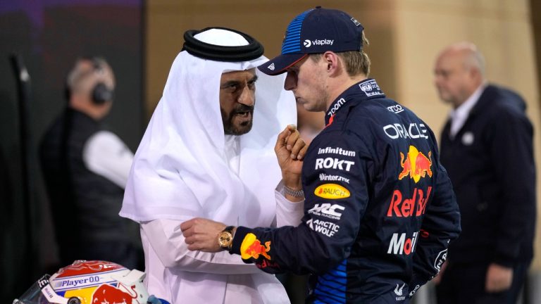 Red Bull driver Max Verstappen of the Netherlands, center, who qualified for pole position, speaks with FIA President Mohammed Ben Sulayem after qualification ahead of the Formula One Bahrain Grand Prix at the Bahrain International Circuit in Sakhir, Bahrain, Friday, March 1, 2024. (Darko Bandic/AP)