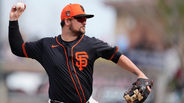 San Francisco Giants third baseman J.D. Davis warms up prior to a spring training baseball game against the Chicago Cubs Saturday, Feb. 24, 2024, in Scottsdale, Ariz. (Ross D. Franklin/AP)