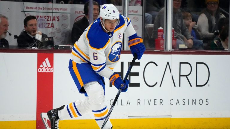 Buffalo Sabres defenceman Erik Johnson (6) passes the puck against the Arizona Coyotes during the first period of an NHL hockey game Saturday, Dec. 16, 2023, in Tempe, Ariz. The Coyotes won 2-0. (Ross D. Franklin/AP Photo)