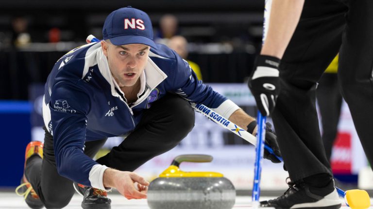 Team Nova Scotia third, Luke Saunders makes a shot against Team Alberta during the Tim Hortons Brier at Budweiser Gardens in London, Ont. on Saturday, March 4, 2023. (Nicole Osborne/CP)