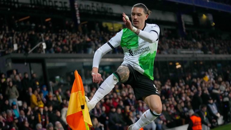 Liverpool's Darwin Nunez kicks the corner flag as he celebrates fater scoring his sides third goal during the Europa League round of 16 first leg, soccer match between Sparta Praha and Liverpool at the Epet Arena in Prague, Czech Republic, Thursday, March 7, 2024. (Petr David Josek/AP)