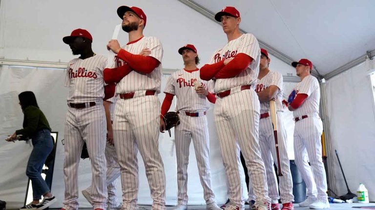 hiladelphia Phillies players wait to have their photo taken during a baseball spring training photo day. (Charlie Neibergall/AP)