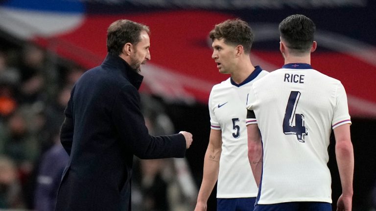 England coach Gareth Southgate speaks to England's John Stones during a friendly soccer match between England and Brazil at Wembley Stadium in London, Saturday, March 23, 2024. (Alastair Grant/AP)