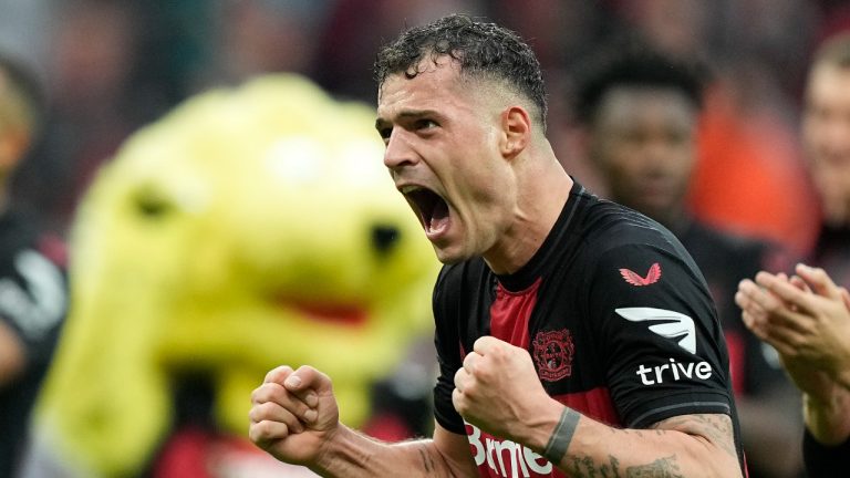 Leverkusen's Granit Xhaka celebrates after winning the German Bundesliga soccer match between Bayer Leverkusen and TSG Hoffenheim at the BayArena in Leverkusen, Germany, Saturday, March 30, 2024. (Martin Meissner/AP)