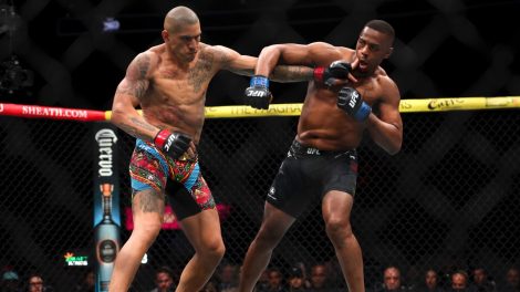 Alex-Pereira,-left,-fights-Jamahal-Hill-during-a-UFC-300-mixed-martial-arts-light-heavyweight-title-bout-in-Las-Vegas.-(Ellen-Schmidt/Las-Vegas-Review-Journal-via-AP)
