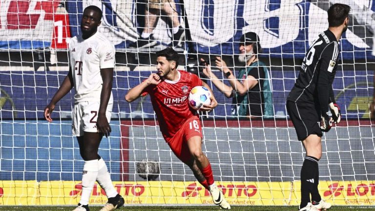 Heidenheim's Kevin Sessa celebrates their side's first goal of the game during the German Bundesliga soccer match between Bayern Munich and 1. FC Heidenheim at Voith-Arena stadium, in Heidenheim, Germany, Saturday, April 6, 2024. (Tom Weller/dpa via AP)
