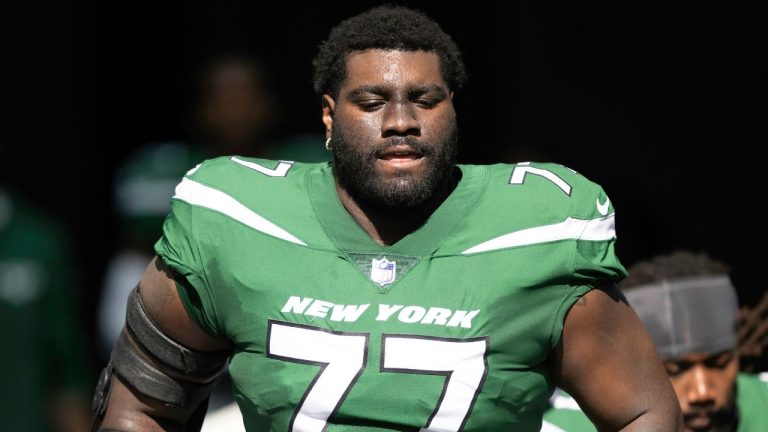 New York Jets tackle Mekhi Becton runs onto the field before an NFL football game against the Miami Dolphins, Sunday, Dec 17, 2023, in Miami Gardens, Fla. (Doug Murray/AP Photo)