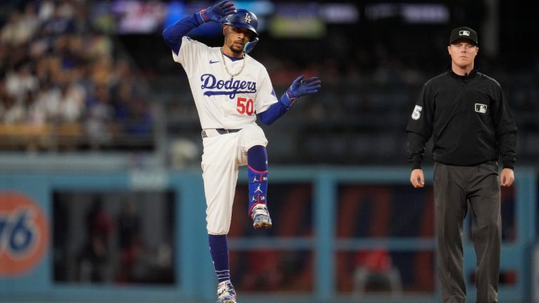 Los Angeles Dodgers' Mookie Betts reacts after driving in a run with a double during the second inning of the team's baseball game against the Washington Nationals, Tuesday, April 16, 2024, in Los Angeles. (Marcio Jose Sanchez/AP)