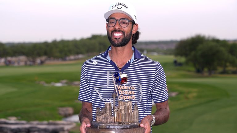 Akshay Bhatia holds his trophy after winning the Texas Open golf tournament. (Eric Gay/AP)