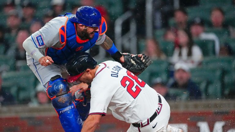 The third game of a four-game series between the Atlanta Braves and New York Mets was postponed on Wednesday because of inclement weather. (AP/John Bazemore)