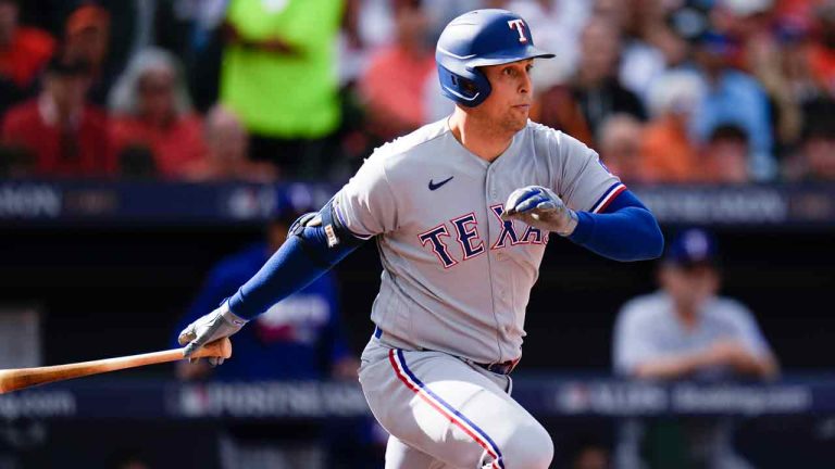 Texas Rangers' Nathaniel Lowe follows through on a swing during the fourth inning in Game 1 of an American League Division Series baseball game between the Baltimore Orioles and the Texas Rangers, Saturday, Oct. 7, 2023, in Baltimore. (Julio Cortez/AP)