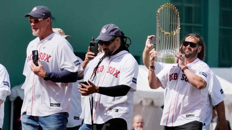 Members of the 2004 Boston Red Sox World Series championship team, Johnny Damon, right, Manny Ramirez, center, and Mike Timlin take the field during ceremonies before an opening day baseball game at Fenway Park against the Baltimore Orioles, Tuesday, April 9, 2024, in Boston. (Michael Dwyer/AP)