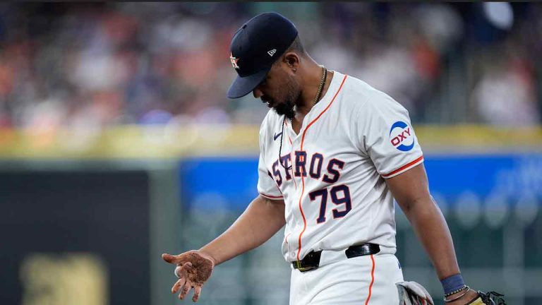 Houston Astros first baseman José Abreu dusts himself off after diving an missing a single hit by Texas Rangers' Evan Carter during the third inning of a baseball game Saturday, April 13, 2024, in Houston. (Kevin M. Cox/AP)