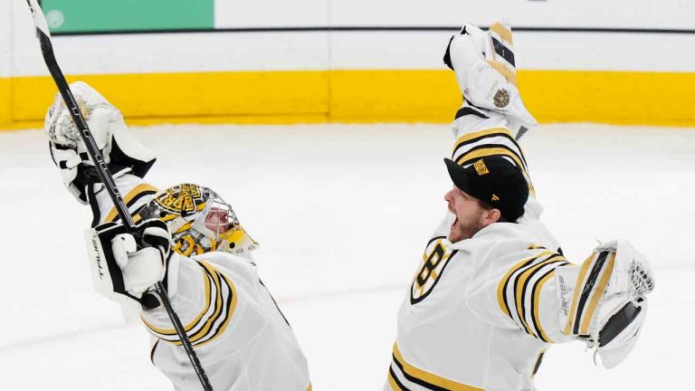 Boston Bruins goaltender Jeremy Swayman, left, and goaltender Linus Ullmark celebrate after defeating the Toronto Maple Leafs in Game 3 of an NHL hockey Stanley Cup first-round playoff series in Toronto on Wednesday, April 24, 2024. (Frank Gunn/CP)