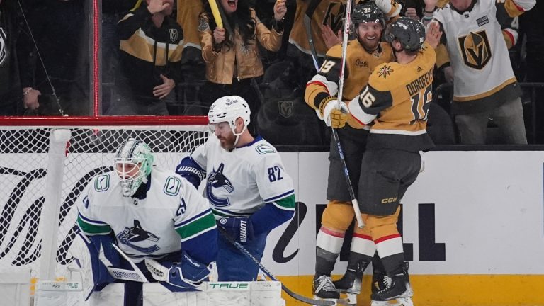 Vegas Golden Knights left wing Pavel Dorofeyev (16) celebrates with Vegas Golden Knights right wing Anthony Mantha after Mantha scored against the Vancouver Canucks during the first period of an NHL hockey game Tuesday, April 2, 2024, in Las Vegas. (John Locher/AP)