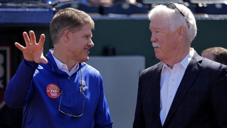 Kansas City Chiefs owner Clark Hunt and Kansas City Royals owner John Sherman talk before a baseball game between the Kansas City Royals and the Minnesota Twins Thursday, March 28, 2024, in Kansas City, Mo.(Charlie Riedel/AP Photo)
