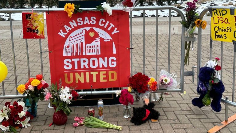 Flowers, signs and other items are gathered in front of Union Station, Friday, Feb. 16, 2024, in Kansas City, Mo. (Nick Ingram/AP Photo)