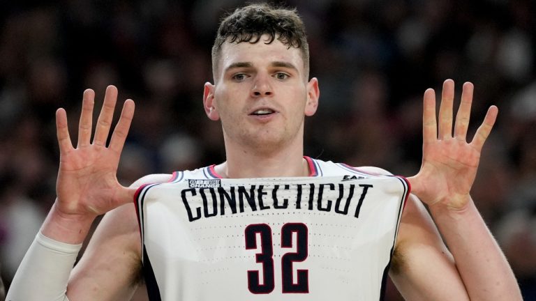 UConn center Donovan Clingan (32) celebrates after their win against Purdue in the NCAA college Final Four championship basketball game, Monday, April 8, 2024, in Glendale, Ariz. (AP Photo/David J. Phillip)