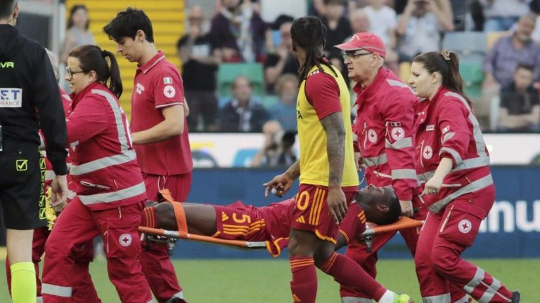 Roma's Evan Ndicka is carried off the pitch on a stretcher during the Serie A soccer match between Udinese and Roma at the Bluenergy Stadium in Udine, Italy, Sunday, April 14, 2024. (Andrea Bressanutti/LaPresse via AP)