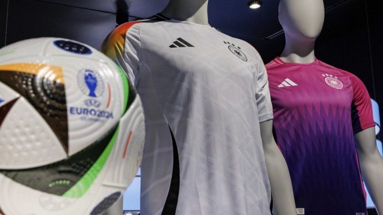 The official jerseys of the German national soccer team for the upcoming European Football Championship 2024 (UEFA EURO 2024) are on display at the headquarters of sporting goods manufacturer adidas AG, in Herzogenaurach, Germany, Thursday, March 14, 2024. The German soccer federation and Adidas have stopped the sale of Germany jerseys with the number 44 because of a resemblance to the logo of the Nazi party’s notorious SS paramilitary units. The federation says it's looking for an alternative design for the number 4 together with its partner. (Daniel Karmann/dpa via AP)