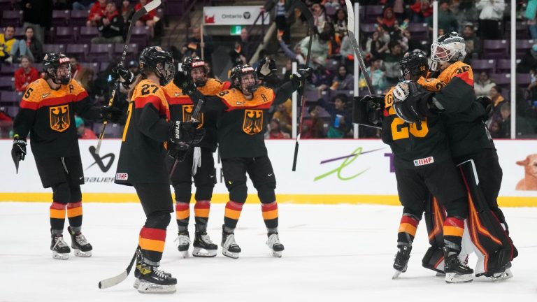 Germany goaltender Sandra Abstreiter (35) celebrates. (Nathan Denette/CP)