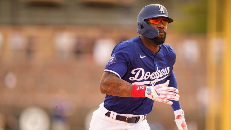 Los Angeles Dodgers' Jason Heyward runs out a triple against the San Francisco Giants during the fifth inning of a spring training baseball game Tuesday, March 12, 2024, in Phoenix. (Lindsey Wasson/AP Photo)