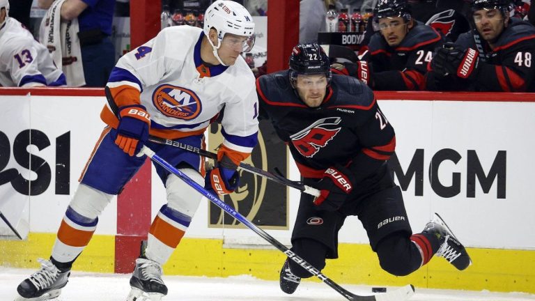New York Islanders' Bo Horvat collides with Carolina Hurricanes' Brett Pesce during the first period in Game 2 of an NHL hockey Stanley Cup first-round playoff series in Raleigh, N.C., Monday, April 22, 2024. (Karl B DeBlaker/AP Photo)