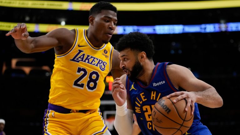 Los Angeles Lakers forward Rui Hachimura (28) defends against Denver Nuggets guard Jamal Murray (27) during the first half of Game 3 of an NBA basketball first-round playoff series in Los Angeles, Thursday, April 25, 2024. (AP Photo/Ashley Landis)
