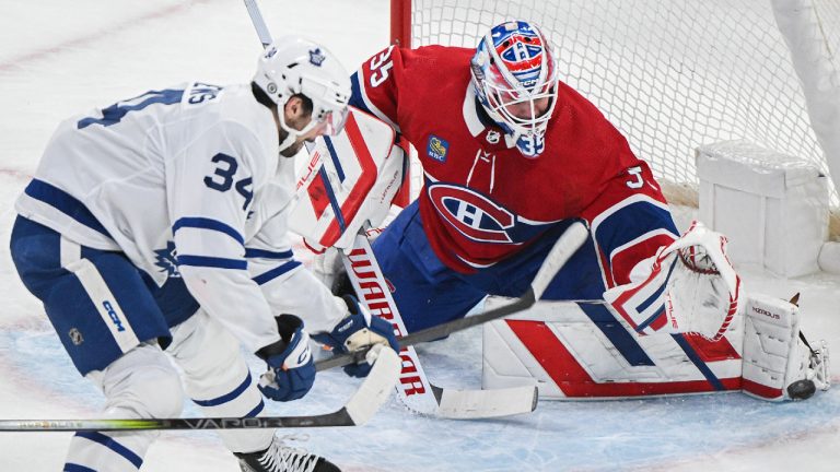 Toronto Maple Leafs' Auston Matthews moves in on Montreal Canadiens goaltender Sam Montembeault during first period NHL hockey action in Montreal, Saturday, April 6, 2024. (Graham Hughes/CP)