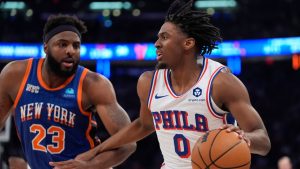 Philadelphia 76ers' Tyrese Maxey looks to pass as New York Knicks' Mitchell Robinson defends during the first half of Game 5 in an NBA basketball first-round playoff series, Tuesday, April 30, 2024, in New York. (Frank Franklin II/AP)