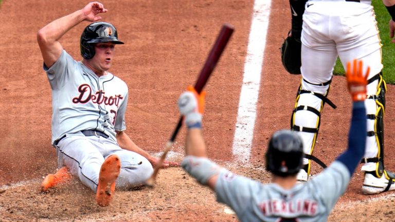 Detroit Tigers' Kerry Carpenter, left, scores on a single by Jake Rogers off Pittsburgh Pirates relief pitcher David Bednar during the ninth inning of a baseball game in Pittsburgh, Tuesday, April 9, 2024. The Tigers won 5-3. (Gene J. Puskar/AP)