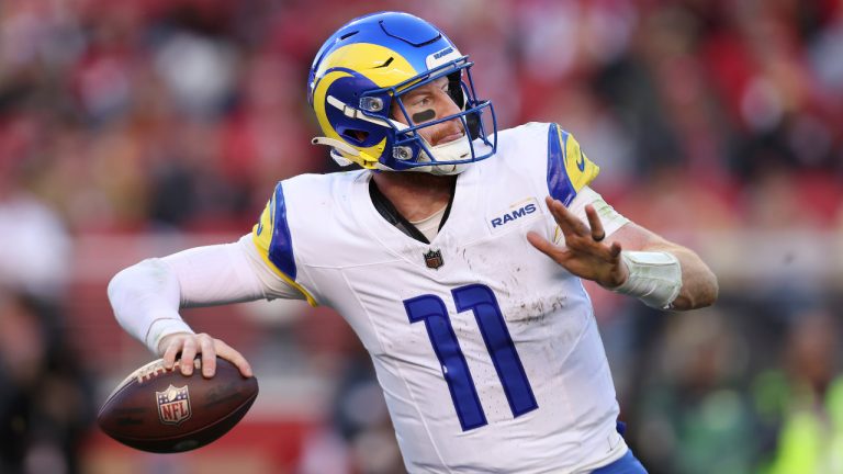 FILE - Los Angeles Rams quarterback Carson Wentz (11) passes against the San Francisco 49ers during the second half of an NFL football game in Santa Clara, Calif., Sunday, Jan. 7, 2024. Carson Wentz has agreed to a one-year contract with the Kansas City Chiefs, a person familiar with the deal told The Associated Press on Tuesday, April 2, 2024. (Jed Jacobsohn/AP)