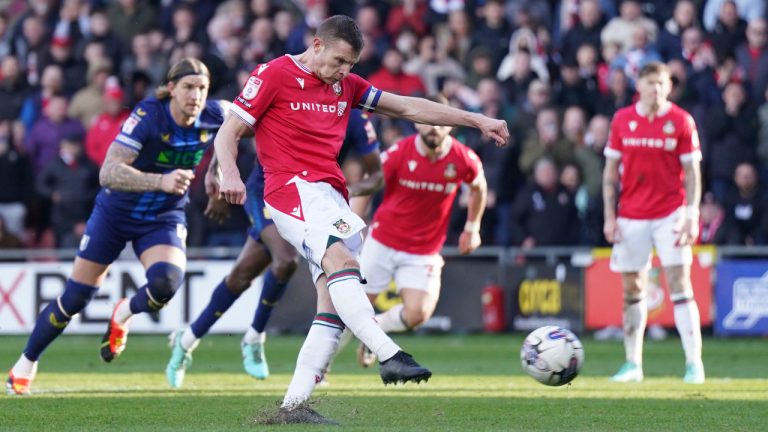 Wrexham's Paul Mullin scores their side's second goal from the penalty spot during the English League Two soccer match between Wrexham and Mansfield Town at the SToK Cae Ras in Wrexham, Wales, Friday, March 29, 2024. (Jacob King/PA via AP)
