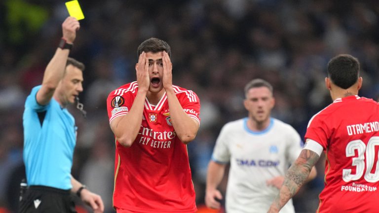 Referee Felix Zwayer shows a yellow card to Benfica's Antonio Silva during the Europa League quarter final second leg soccer match between Olympique de Marseille and SL Benfica at the Velodrome stadium in Marseille, south of France, Thursday, April 18, 2024. (Daniel Cole/AP)