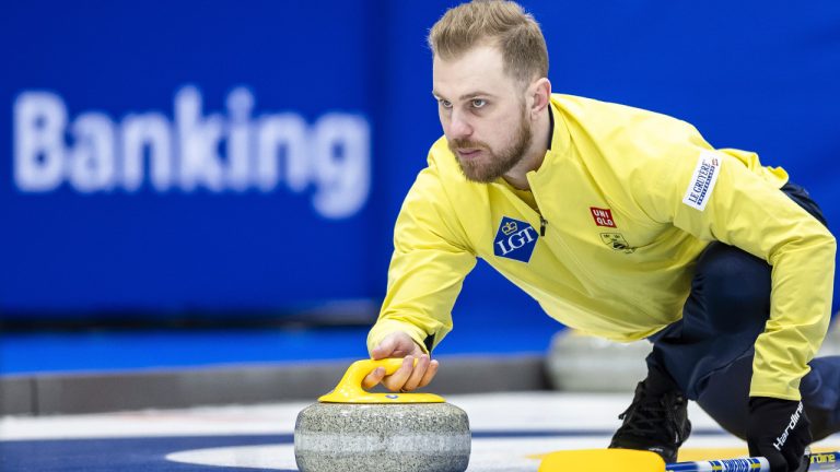 Sweden's Rasmus Wranå delivers a stone in this file photo from the World men's Curling Championship, at the IWC Arena in Schaffhausen, Switzerland on Sunday March 31, 2024. (Michael Buholzer/AP)
