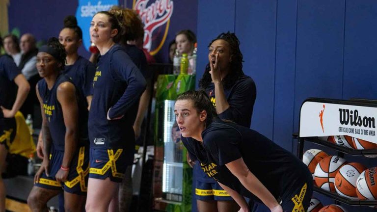Indiana Fever guard Caitlin Clark, front right, watches from the sideline with her teammates as the WNBA basketball team practices in Indianapolis. (Michael Conroy/AP)
