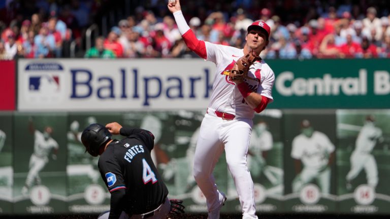 Miami Marlins' Nick Fortes (4) is out at second as St. Louis Cardinals second baseman Nolan Gorman, right, turns the double play during the third inning of a baseball game Saturday, April 6, 2024, in St. Louis. The Marlins Luis Arraez was out at first. (Jeff Roberson/AP)