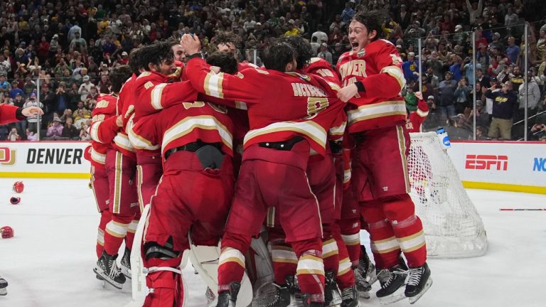 Denver celebrates after winning the championship game against Boston College in the Frozen Four NCAA college hockey tournament Saturday, April 13, 2024, in St. Paul, Minn. Denver won 2-0 to win the national championship. (Abbie Parr/AP Photo)