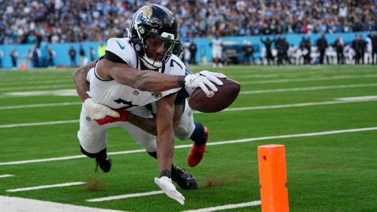 Jacksonville Jaguars wide receiver Zay Jones (7) is stopped short of the goal line by Tennessee Titans cornerback Sean Murphy-Bunting (0) during the second half of an NFL football game Sunday, Jan. 7, 2024, in Nashville, Tenn. (George Walker IV/AP)