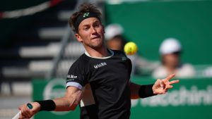 Casper Ruud of Norway returns to Stefanos Tsitsipas of Greece during their Monte Carlo Tennis Masters final match in Monaco, Sunday, April 14, 2024. (Daniel Cole/AP)