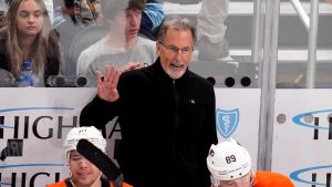 Philadelphia Flyers head coach John Tortorella gives instructions during overtime of an NHL game. (AP)