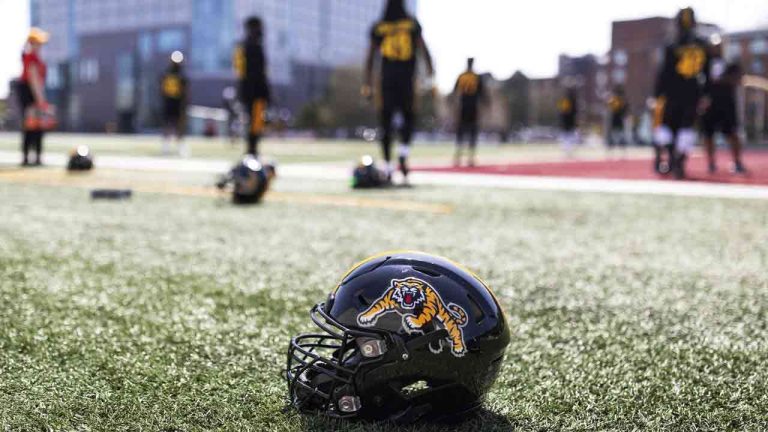 The Hamilton Tiger-Cats will add Hall of Famers Mike Walker and Bernie Custis to their Wall of Honour this season. Members of the Tiger-Cats run though a drill during the opening day of CFL training camp at Ron Joyce Stadium in Hamilton, Ont., Thursday, May 19, 2022. (Nick Iwanyshyn/CP)