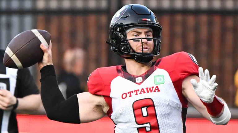 Ottawa Redblacks quarterback Nick Arbuckle throws a pass during first half CFL football action against the Montreal Alouettes in Montreal, Saturday, June 10, 2023. (Graham Hughes/CP)