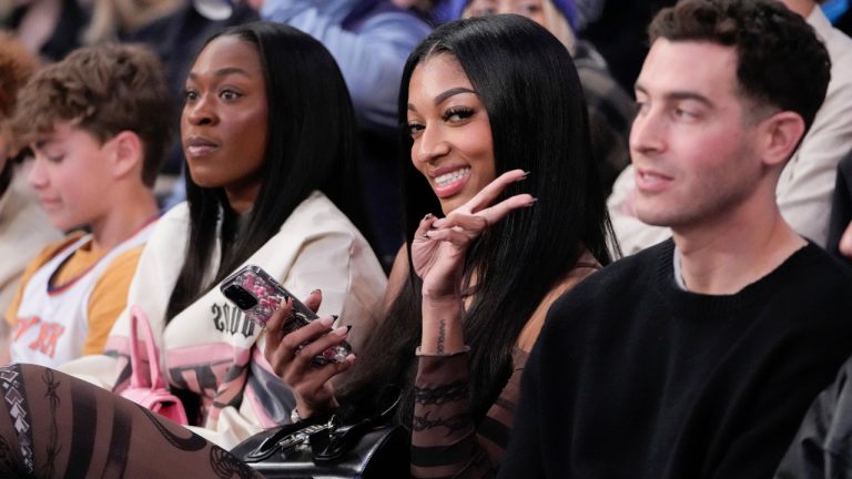LSU basketball forward Angel Reese, gestures at photographers during a time out in the second half of an NBA basketball game between the New York Knicks and the Brooklyn Nets, Friday, April 12, 2024, at Madison Square Garden in New York. (Mary Altaffer/AP) 