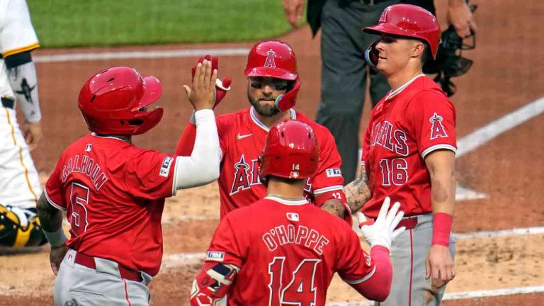 Los Angeles Angels' Kevin Pillar, top centre, is greeted by Mickey Moniak (16) and Willie Calhoun (5), who were on base for his three-run home run off Pittsburgh Pirates starting pitcher Quinn Priester during the fourth inning of a baseball game in Pittsburgh, Tuesday, May 7, 2024. (Gene J. Puskar/AP)