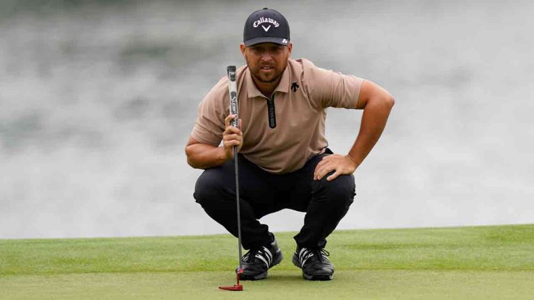 Xander Schauffele lines up a putt on the 14th hole during the first round of the Wells Fargo Championship golf tournament at the Quail Hollow Club Thursday, May 9, 2024, in Charlotte, N.C. (Erik Verduzco/AP)